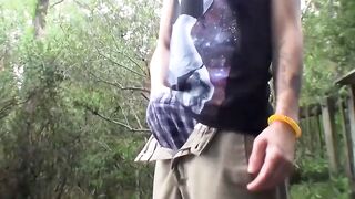 Tattooed glasses thug pees then jerks cock outdoors