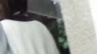 Rain didnt stop this Asian cutie from fingering her twat outdoors