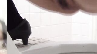 Japanese babes caught on spycam pissing in a public toilet