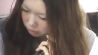Japanese honey caught on cam rubbing pussy outdoors