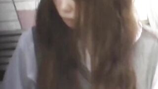 Japanese honey caught on cam rubbing pussy outdoors