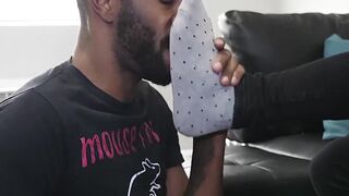 Black stud strokes thick cock as buddy hungrily licks his feet