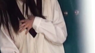 Rain wont stop Asian cutie fingering twat outdoors
