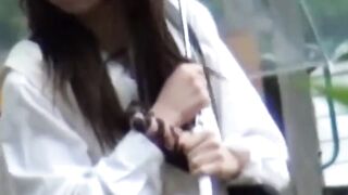 Rain wont stop Asian cutie fingering twat outdoors