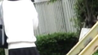 Rain wont stop Asian cutie fingering twat outdoors
