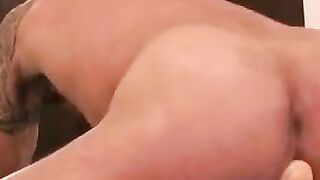 Rugged stud strokes hard with toy in his tight asshole