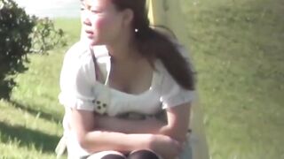 Naughty cutie pees through soaked clothes in a public spot