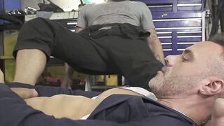 Mechanic dom wrestles hunk down for sweaty foot worship
