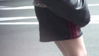 Her golden stream leaks through her panties in public corner