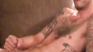 Tattooed hairy amateur strokes his cock hard and cums