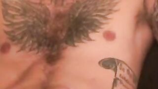 Tattooed hairy amateur strokes his cock hard and cums