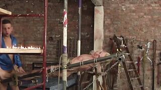 Blond sub restrained for painful hot wax body art