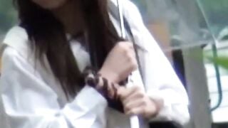 Downpour fails to halt this Asian babe probing vag outdoors
