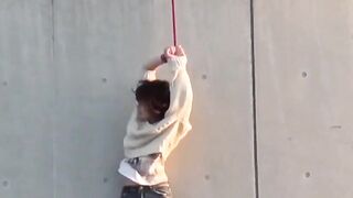 Restrained Asian babes peeing down pant legs