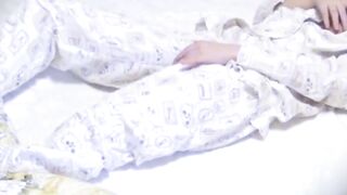 Japanese cutie strips pajamas and toys pussy in bed