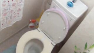 Horny schoolgirl slips into the bathroom to finger cunt