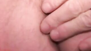 Mature tattooed man with cock ring strokes cock and cums