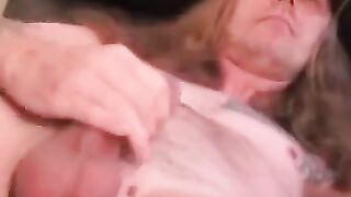 Mature tattooed man with cock ring strokes cock and cums