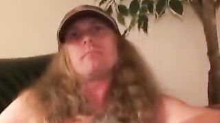 Mature tattooed man with cock ring strokes cock and cums