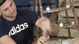 Jock stroked hard while wax poured on his body