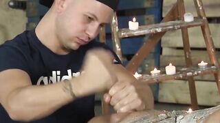 Jock stroked hard while wax poured on his body
