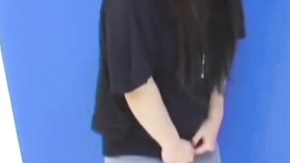 Brunette Japanese teen peeing pants after losing control