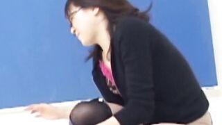Kinky Asian brunette soaking clothes during photoshoot