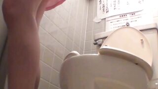 Asian office gals crouch to dump golden flow into toilet bowl