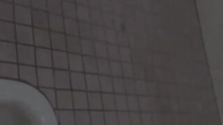 Hidden cam records Japanese women pissing in a restroom