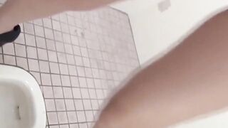 Hidden cam records Japanese women pissing in a restroom