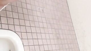 Hidden cam records Japanese women pissing in a restroom