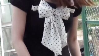 Adorable Asian girl rubbing hairy pussy outdoor
