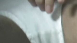 Japanese woman unknowing as she entertains herself on tape