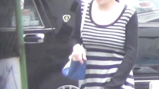 Asian girls pour golden from bushy vag into urinal spot