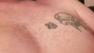 Inked middle aged guy cums on plate after jerking off