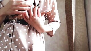 Gorgeous babe with big tits teases in a sexy BDSM dress.