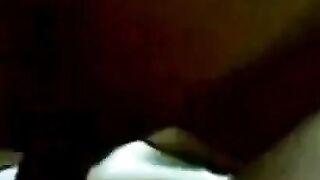 Asian Couple Sharing Intimate Moments in Bed