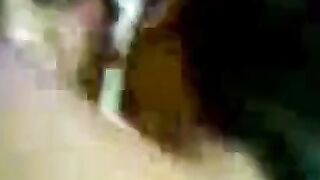 Asian Couple Sharing Intimate Moments in Bed
