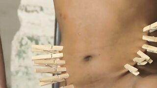 Elio Amari endures painful pegs on his naked body