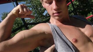 Muscular blond twink workouts on playground pull-up bars and shows his dick