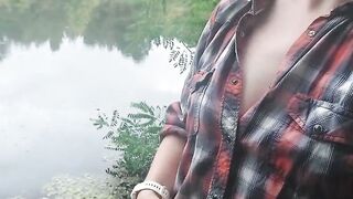 Brunette teen masturbates by the lake