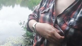 Brunette teen masturbates by the lake