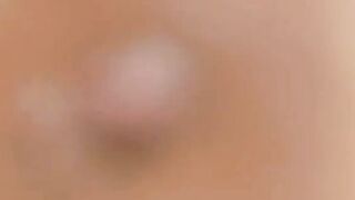 Big-Titted Brunette Oils Up Her Massive Breasts