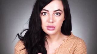 Brunette Girl in Brown Sweater Talks to Camera Close Up
