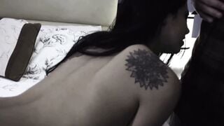 Tattooed Brunette on All Fours Takes Cock in Bedroom