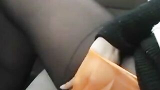 Black Stocking Legs in Car Foot on Steering Wheel