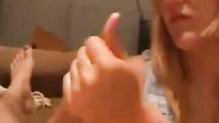 Blonde Woman Gives Foot Job on Couch with Tank Top