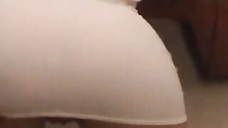 Brunette in White Lingerie Bends Over to Show Off Her Ass