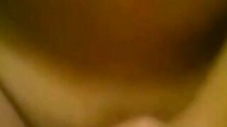 Close-up of a hand pulling down green underwear to reveal bare skin