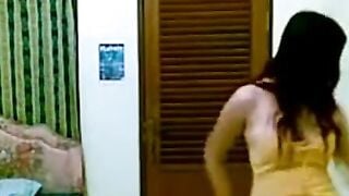 Indonesian Babe Strips in Yellow Top for Horny Joged Dance